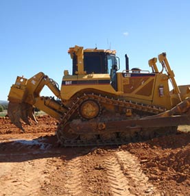 Medium sized excavator on dirt