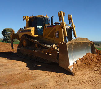 Medium sized excavator on dirt