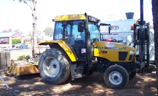 Case Tractor w/ Auger and Broom 1