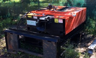 Wombat Cable Pusher set up on a Skid Steer 4 in 1 frame 1